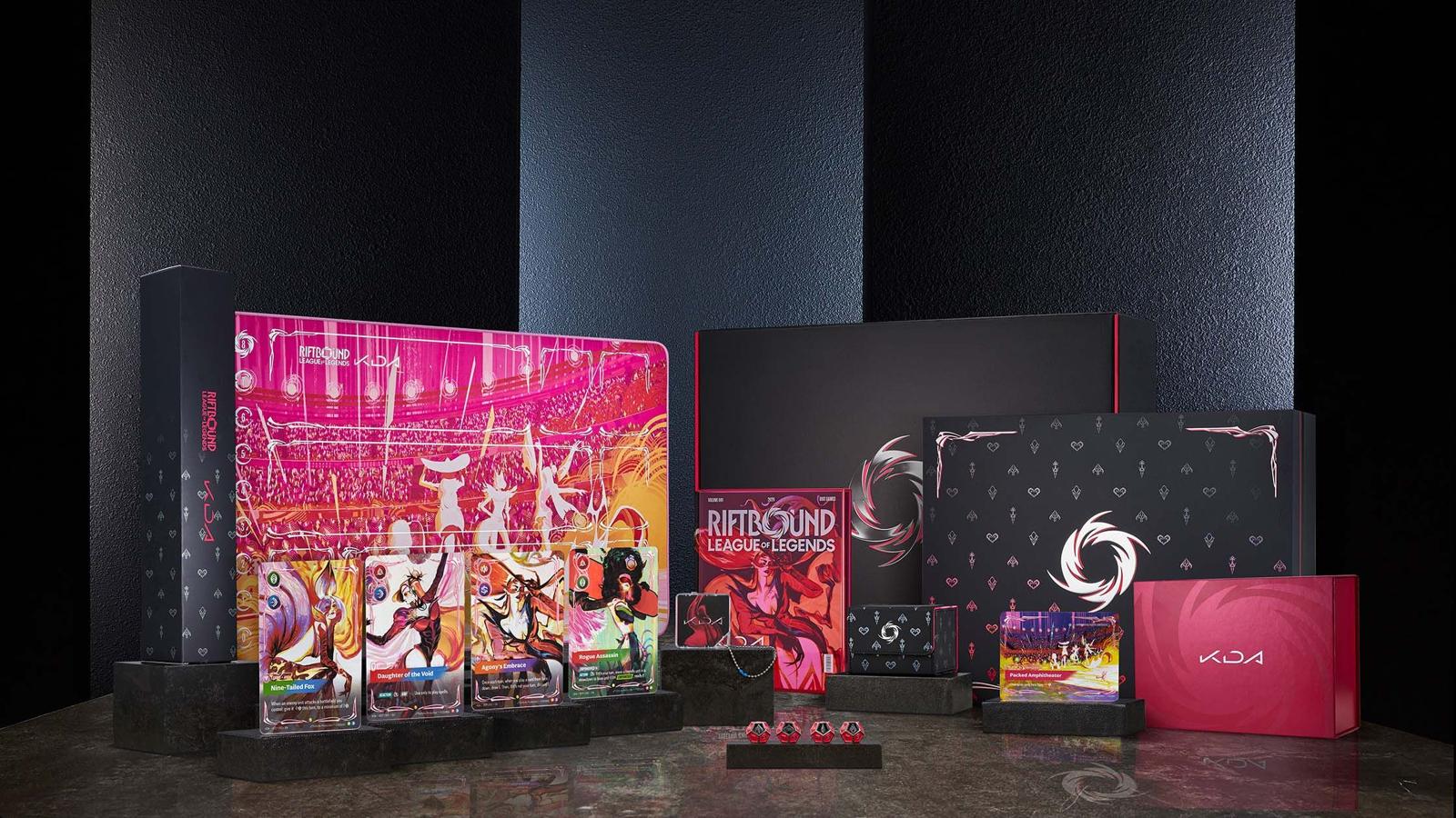 Riftbound x K/DA Couture Collection showing four Legend cards in front of a pink K/DA playmat with deck boxes and dice